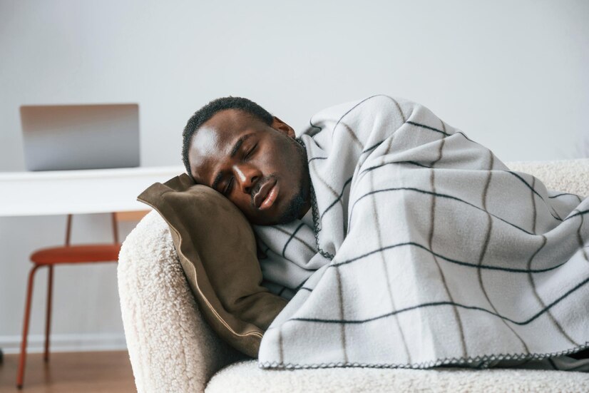 lying-down-sofa-sick-black-man-is-home_146671-115601